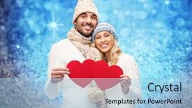  Presentation with glitter - Theme featuring love valentines day couple christmas and people concept - smiling man and woman in winter hats and scarf holding red paper heart shapes over blue glitter and holidays lights background background and a light blue colored foreground
