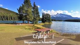 Presentation with banff national park - PPT theme enhanced with lovely spot for a picnic by the lake - a wooden table and bench quiet shallow lake in banff national park in canada sunset background and a coral colored foreground