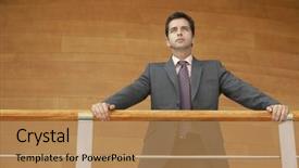  Presentation with low angle view of volleyball - Presentation with low angle view of confident young businessman leaning on railing while standing against wooden wall background and a coral colored foreground