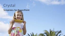  Presentation with corn cob - Presentation theme consisting of low angle view of a smiling young girl eating corn on the cob against sky background and a light blue colored foreground