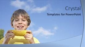  Presentation with corn cob - Presentation theme having low angle view of a smiling young boy eating corn on the cob against sky background and a light blue colored foreground