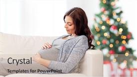  Presentation with pregnancy medicine healthcare and people - Audience pleasing PPT layouts consisting of lying on sofa over christmas backdrop and a  colored foreground
