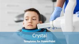  Presentation with healthcare - Theme enhanced with machine scanning kid patient teeth background and a teal colored foreground