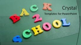  Presentation with magnetic - Colorful PPT theme enhanced with magnetic alphabet letters on a green chalkboard spelling out back to school backdrop and a seafoam green colored foreground