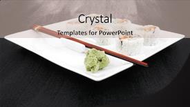  Presentation with fresh avocado - Slides enhanced with maki sushi - california roll made of fresh raw salmon cream cheese and avocado inside served with wasabi over black table on square white plate background and a mint green colored foreground