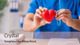  Presentation with cardiologist - Audience pleasing PPT theme consisting of male doctor cardiologist holding heart backdrop and a soft green colored foreground