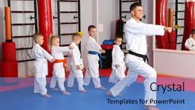  Presentation with karate - Theme enhanced with male karate instructor training little background and a teal colored foreground