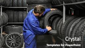  Presentation with mechanic - Amazing PPT theme having male mechanic holding car tire backdrop and a dark gray colored foreground