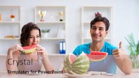  Presentation with eating - Audience pleasing PPT theme consisting of man-and-woman-eating-watermelon backdrop and a coral colored foreground