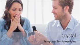  Presentation with engagement - PPT theme with man asking partner to marry him by giving her a engagement ring background and a light blue colored foreground