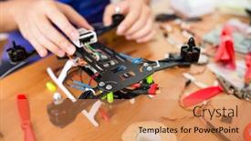  Presentation with parts - Colorful PPT theme enhanced with man connecting the electronic parts on drone backdrop and a coral colored foreground