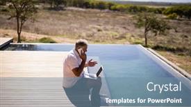  Presentation with safari - Beautiful PPT theme featuring man-using-laptop-while-talking backdrop and a seafoam green colored foreground