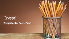  Presentation with color pencils - Audience pleasing PPT theme consisting of many pencils in metal holder on wooden table and shaded color background backdrop and a tawny brown colored foreground
