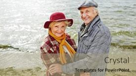  Presentation with married couple - Amazing PPT layouts having married senior couple smiling and embracing on the beach backdrop and a mint green colored foreground