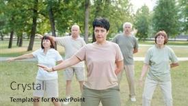  Presentation with qigong - Colorful slides enhanced with mature-brunette-instructor-moving-arm backdrop and a mint green colored foreground