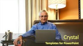  Presentation with business hotel - Presentation theme featuring mature businessman sitting on the couch in his hotel room holding a drink while working on his laptop business travel concept background and a tawny brown colored foreground