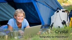  Presentation with camp - Colorful PPT layouts enhanced with mature woman smiling and using computer on her camp site backdrop and a seafoam green colored foreground