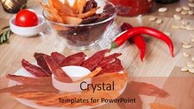  Presentation with pumpkin seeds - Presentation featuring meat chips on a plate with pepper pumpkin seeds and pepper background and a coral colored foreground