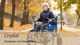  Presentation with wheelchair - PPT theme with medical city - little boy in wheelchair outdoors background and a coral colored foreground