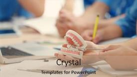  Presentation with jaw - PPT theme enhanced with medical study - student holding dental jaw model background and a coral colored foreground