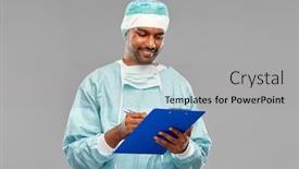  Presentation with surgery - Audience pleasing theme consisting of medicine surgery and people concept - smiling indian male doctor or surgeon in protective wear with clipboard over grey background backdrop and a light gray colored foreground