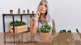  Presentation with hand holding plant - PPT theme having middle-age-grey-haired-woman background and a coral colored foreground