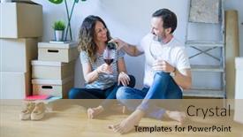  Presentation with drinking glass - Audience pleasing presentation design consisting of middle age senior romantic couple in love sitting on the apartment floor with boxes around celebrating drinking a glass of wine smiling happy for moving to a new home backdrop and a coral colored foreground