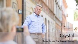  Presentation with man and woman - Audience pleasing slide deck consisting of middle-aged woman taking picture of man in city backdrop and a light gray colored foreground