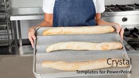  Presentation with restaurant kitchen - Presentation theme featuring midsection of female chef presenting baked loafs in restaurant kitchen background and a soft green colored foreground
