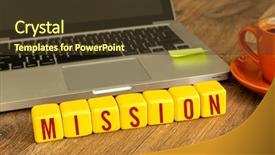  Presentation with mission - Cool new PPT theme with mission written on a wooden cube in front of a laptop backdrop and a tawny brown colored foreground