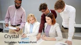  Presentation with green office - Presentation theme featuring green renewable energy teamwork corporate and people concept - business team with papers and wind turbine model meeting and discussing project at office background and a soft green colored foreground