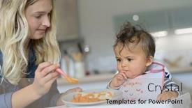  Presentation with mom baby - Amazing slide deck having mom-feeding-8-month-old backdrop and a coral colored foreground