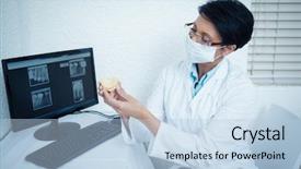  Presentation with wearing a surgical face mask - PPT layouts consisting of monitor x ray - female dentist wearing surgical mask background and a light blue colored foreground