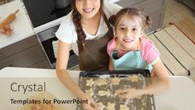  Presentation with baking cookies - Presentation theme with mother and daughter putting cookies of raw dough on baking tray indoors background and a coral colored foreground
