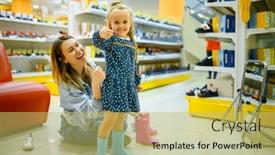  Presentation with baby shoes - Slide set consisting of mother-and-little-baby-choosing background and a yellow colored foreground