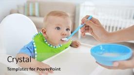  Presentation with mother feeding baby breast milk - Beautiful PPT theme featuring mother feeding baby with spoon backdrop and a soft green colored foreground