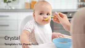  Presentation with mother feeding baby breast milk - Presentation having mother feeding baby with spoon background and a soft green colored foreground