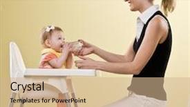  Presentation with baby bottle - Colorful PPT theme enhanced with mother holding bottle for baby daughter sitting in highchair backdrop and a coral colored foreground