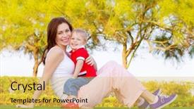  Presentation with spring nature grass - Cool new presentation with mother with cute baby boy sitting down on green grass in spring park mom with son enjoying springtime nature happy family spending time outdoors backdrop and a yellow colored foreground