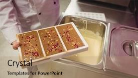  Presentation with chocolate - Amazing PPT theme having moulding process - mid section of worker holding backdrop and a  colored foreground