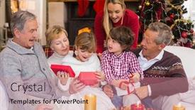  Presentation with living room family - Audience pleasing PPT layouts consisting of multi generation family opening presents on sofa at home in the living room backdrop and a coral colored foreground