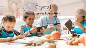  Presentation with paper cutting - PPT theme enhanced with multiracial schoolkids and young teacher in aprons cutting out halloween decorations from sheets of black paper background and a coral colored foreground