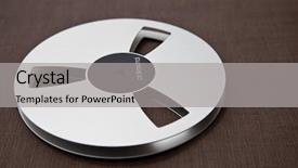  Presentation with audio professional - Audience pleasing PPT theme consisting of music technology - professional audio metal reel backdrop and a light gray colored foreground
