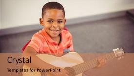  Presentation with guitar - Beautiful PPT theme featuring musique - portrait of smiling schoolboy playing backdrop and a  colored foreground