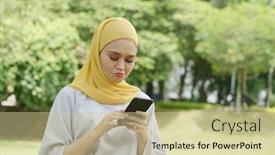  Presentation with woman muslim - Audience pleasing theme consisting of muslim-woman-looking-at-mobile backdrop and a soft green colored foreground