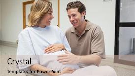  Presentation with neonate - Audience pleasing presentation theme consisting of neonate growth - pregnant woman in wheelchair talking backdrop and a coral colored foreground