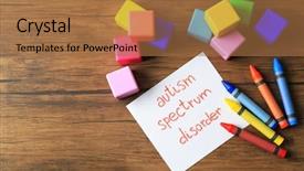  Presentation with autism - Theme with neuropsychology - colorful pencils cubes and paper background and a coral colored foreground