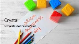  Presentation with autism awareness - Cool new slides with neuropsychology - colorful pencils cubes and paper backdrop and a light gray colored foreground