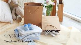  Presentation with new baby - Slides enhanced with new baby clothes on bed background and a lemonade colored foreground