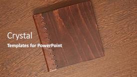  Presentation with note book - Cool new slides with note-book-with-hard-wooden backdrop and a tawny brown colored foreground